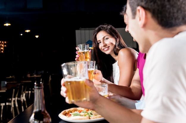 Cheerful friends in the pub.