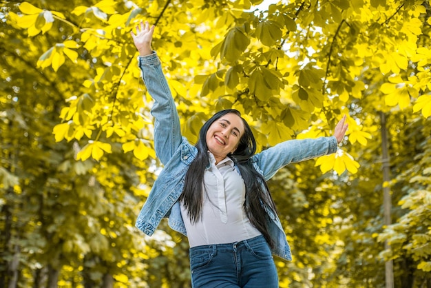 cheerful girl with black hair in the park.