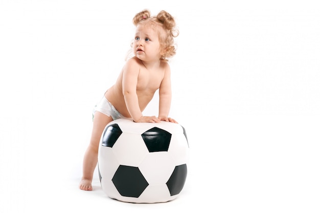 Cheerful girl with a soccer ball