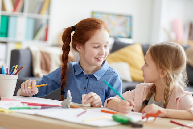 Cheerful Girls Drawing Pictures