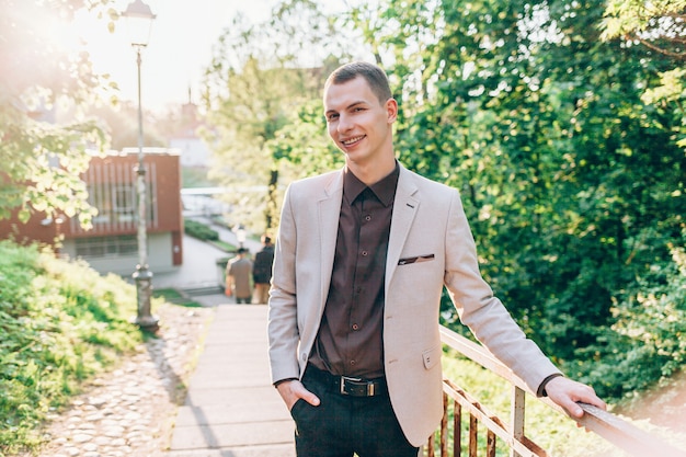 Cheerful guy smiles on walk