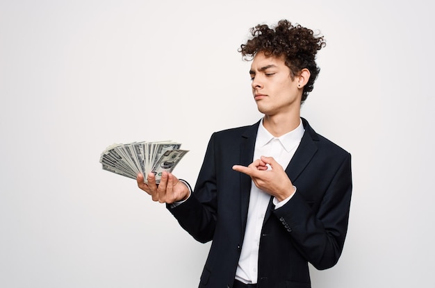 Cheerful guy with curly hair in suit official isolated background