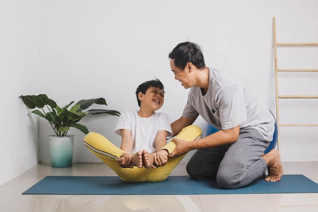 Cheerful instructor and students practicing yoga at home