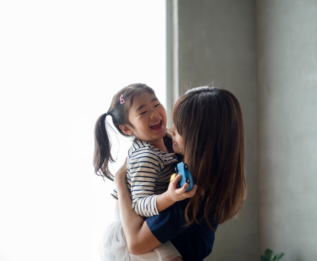 Cheerful japanese mother and daughter