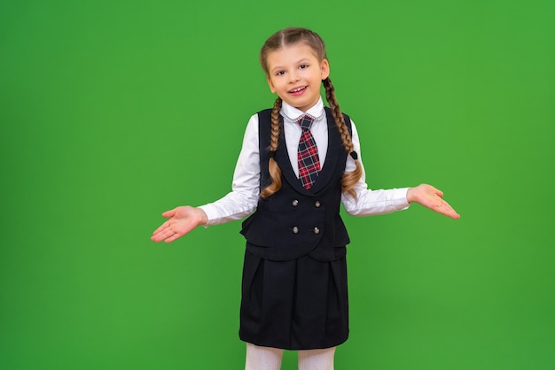 A cheerful and joyful schoolgirl with a briefcase on an isolated background