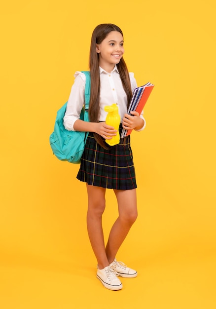 Cheerful kid going on lunch teenager student hold planner notebook