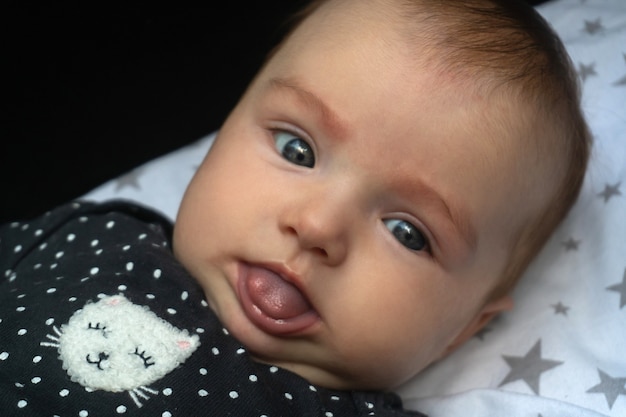 Cheerful little baby girl in stroller