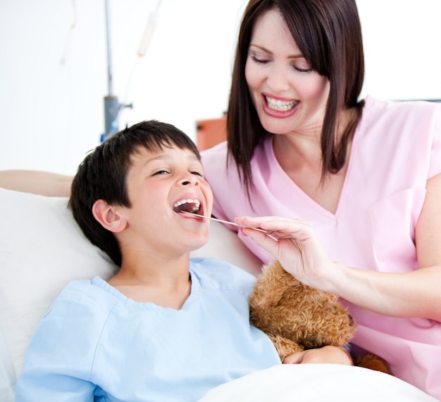 Cheerful little boy attending a medical exam 