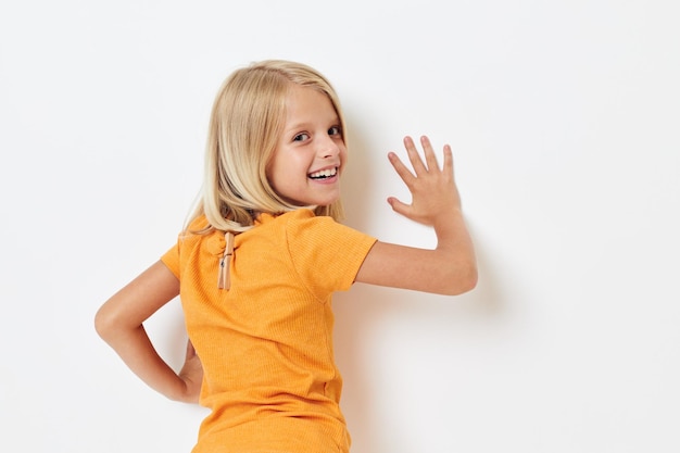 Cheerful little girl in casual clothes childhood studio