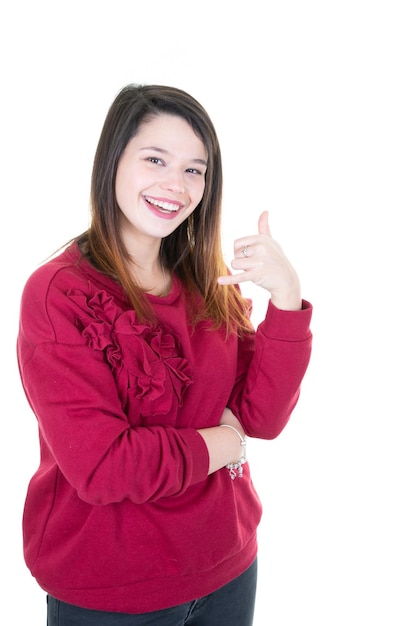 Cheerful lovely girl showing thumbs up