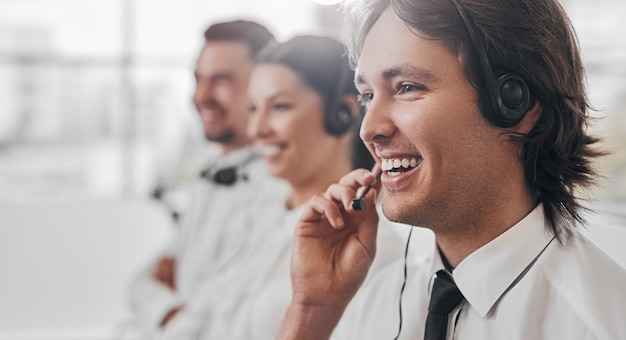 Cheerful male operator speaking with customer