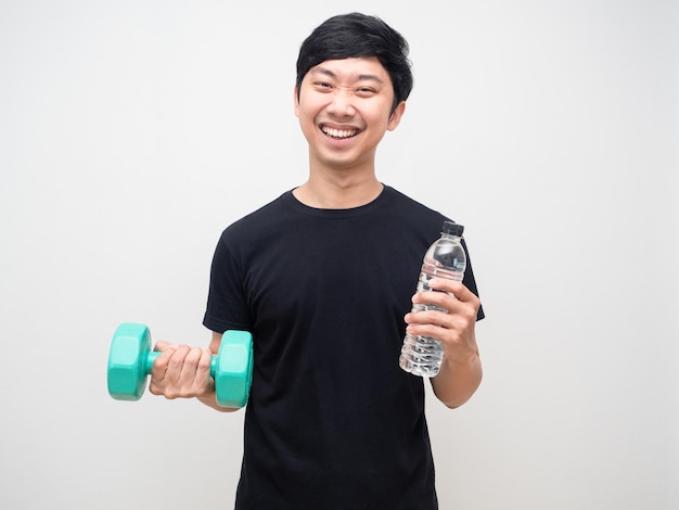 Cheerful man holding dumbbell with water bottle workout concept isolated