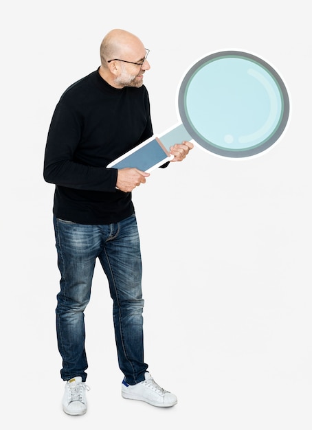 Cheerful man holding a magnifier icon