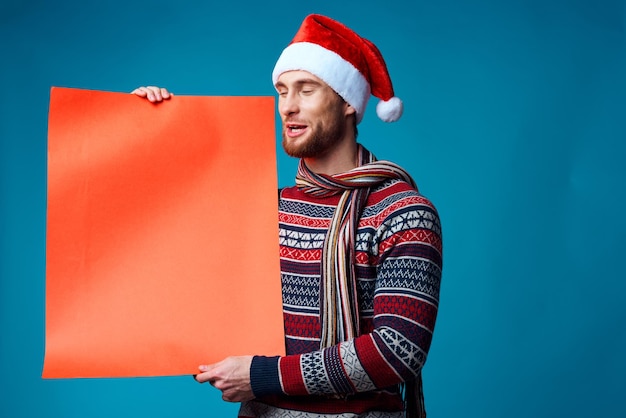Cheerful man in New Year39s clothes advertising copy space studio posing