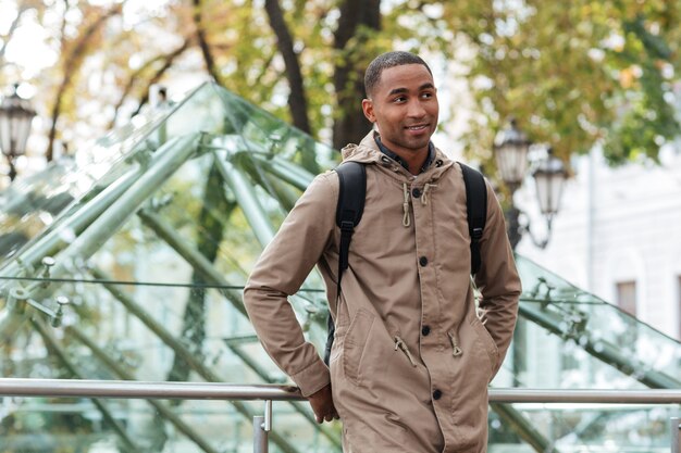 Cheerful man walking on the street