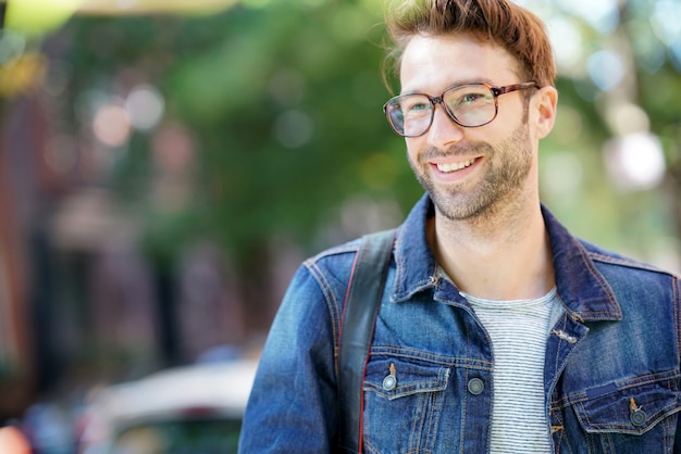 Cheerful man walking in the street