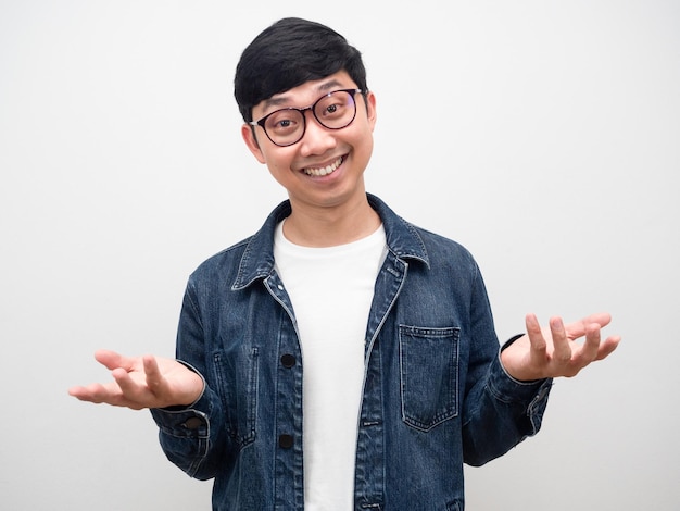 Cheerful man wearing glasses jeans shirt smile gesture i dont know