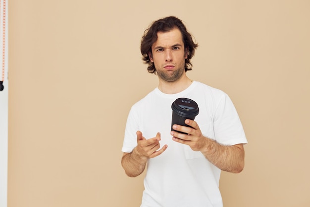 Cheerful man with a black glass in a white tshirt isolated background