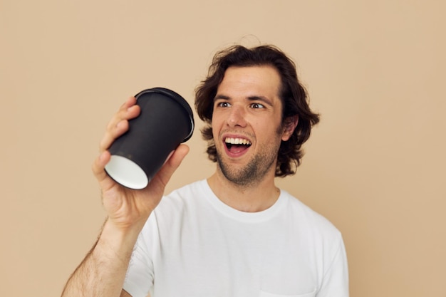 Cheerful man with a black glass in a white tshirt isolated background