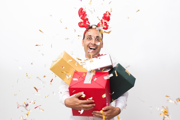 Cheerful Man With Gift Boxes and Confetti Around