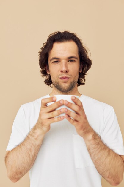 Cheerful man with a white mug in his hands emotions posing Lifestyle unaltered