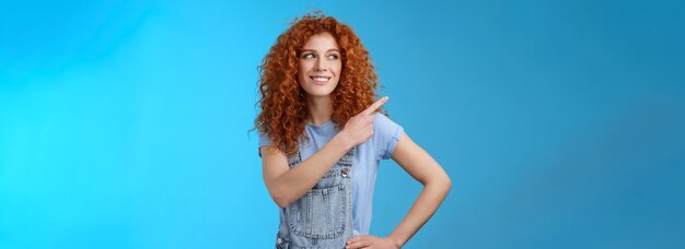 Photo cheerful motivated charismatic goodlooking happy smiling redhead s curlyhaired woman summer dungaree