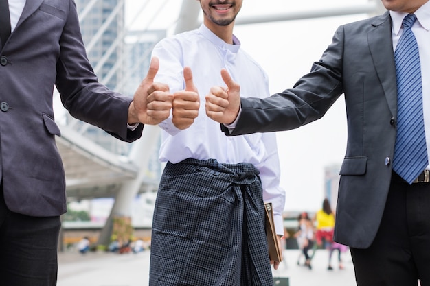 Cheerful Multiracial businessman teamwork with giving thumbs up