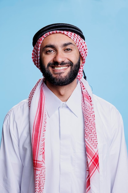 Cheerful muslim man studio portrait