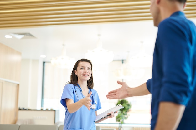 Cheerful Nurse Greeting Patient