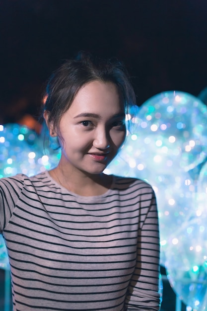 Cheerful optimistic Asian woman smiling