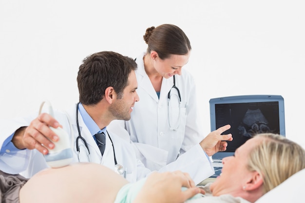 Cheerful pregnant blonde woman having an ultrasound scan