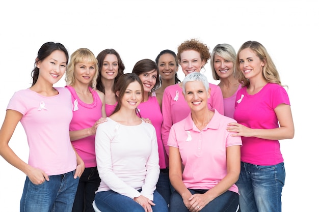 Cheerful pretty women posing and wearing pink for breast cancer