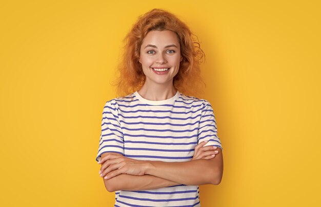 Cheerful redhead woman face isolated on yellow background face of young redhead woman