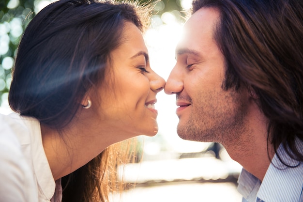 Cheerful romantic couple kissing