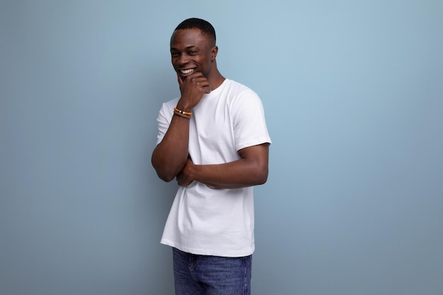 Cheerful s african man with short haircut in white tank top