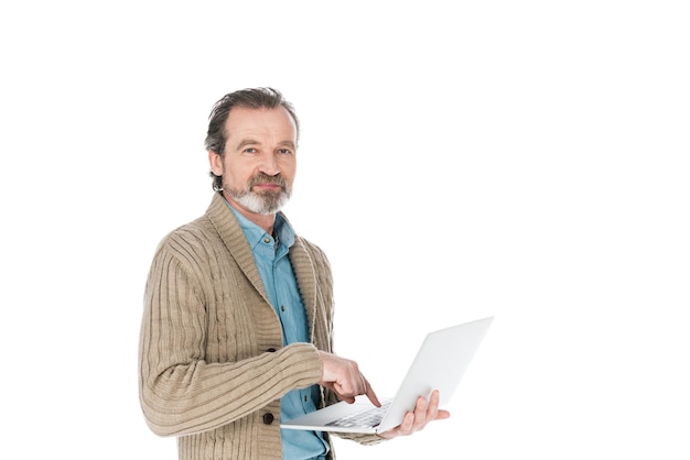 Cheerful senior man holding laptop isolated on white