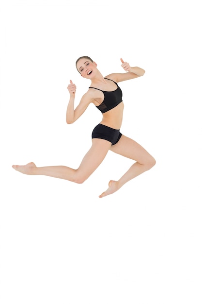 Cheerful slim model jumping in the air