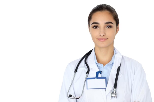 Cheerful smiling female doctor isolated over white background. Latin american or Hispanic young woman.