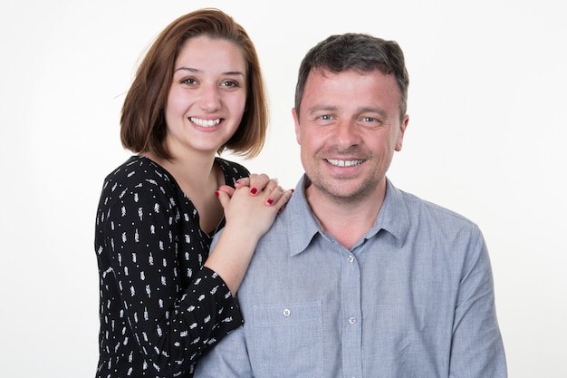 Cheerful smiling happy couple in white background