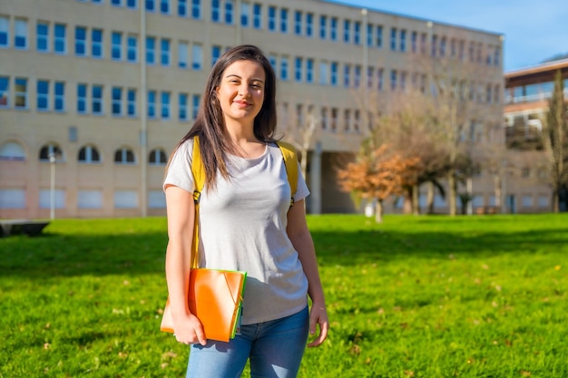 Cheerful student outside the university college