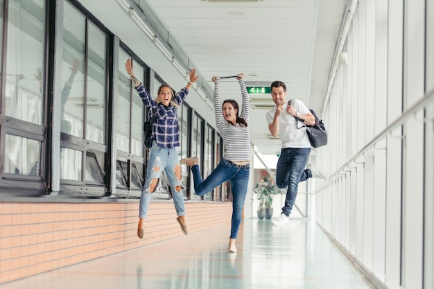 Cheerful students jumping