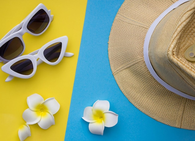 A cheerful summer composition of a single hat sunglasses