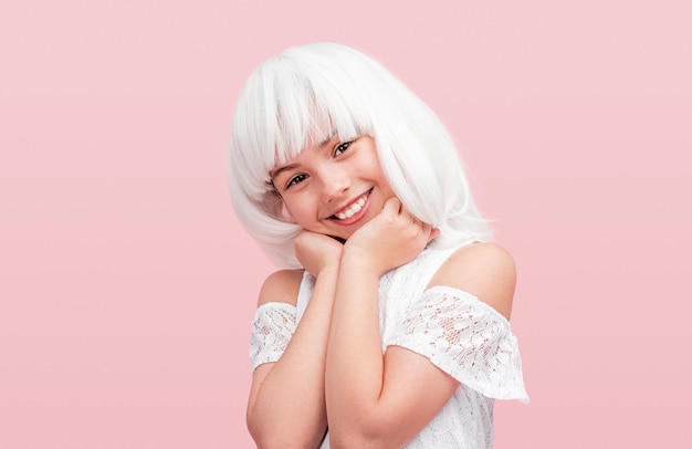 Cheerful teen girl in white wig