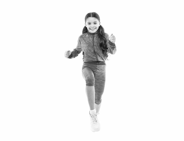cheerful teen sport girl run in studio teen sport girl run on background photo of teen sport girl