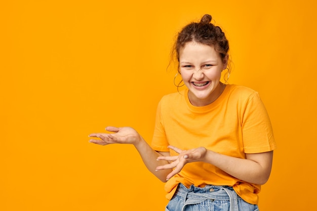 Cheerful woman fun earrings grimace hand gesture youth style lifestyle unaltered