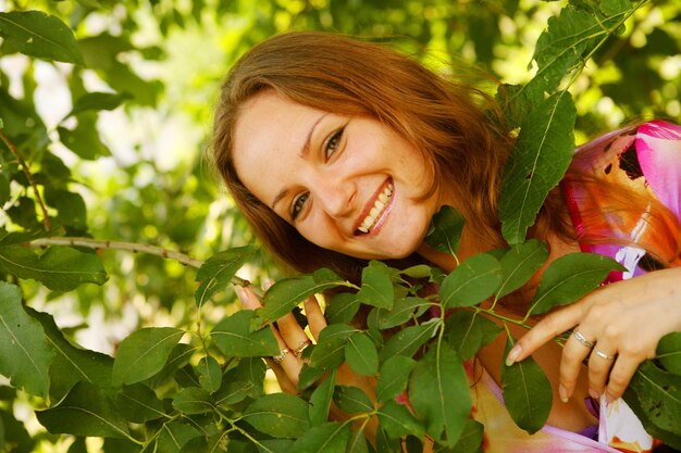 Cheerful woman in the garden