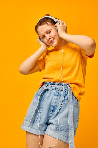 Cheerful woman grimace headphones music technology cropped view unaltered