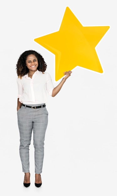 A cheerful woman holding a star