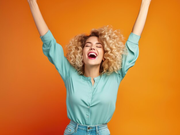 Cheerful woman is dancing with her hands up