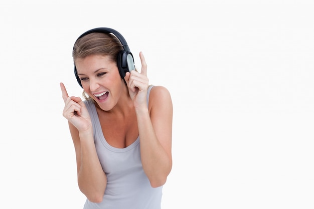 Cheerful woman listening to music